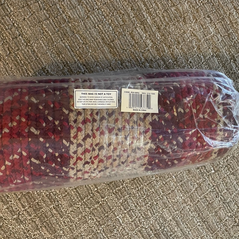 Braided runner rug 20”x 8’.Red, burgundy and khaki colors. Brand new in package